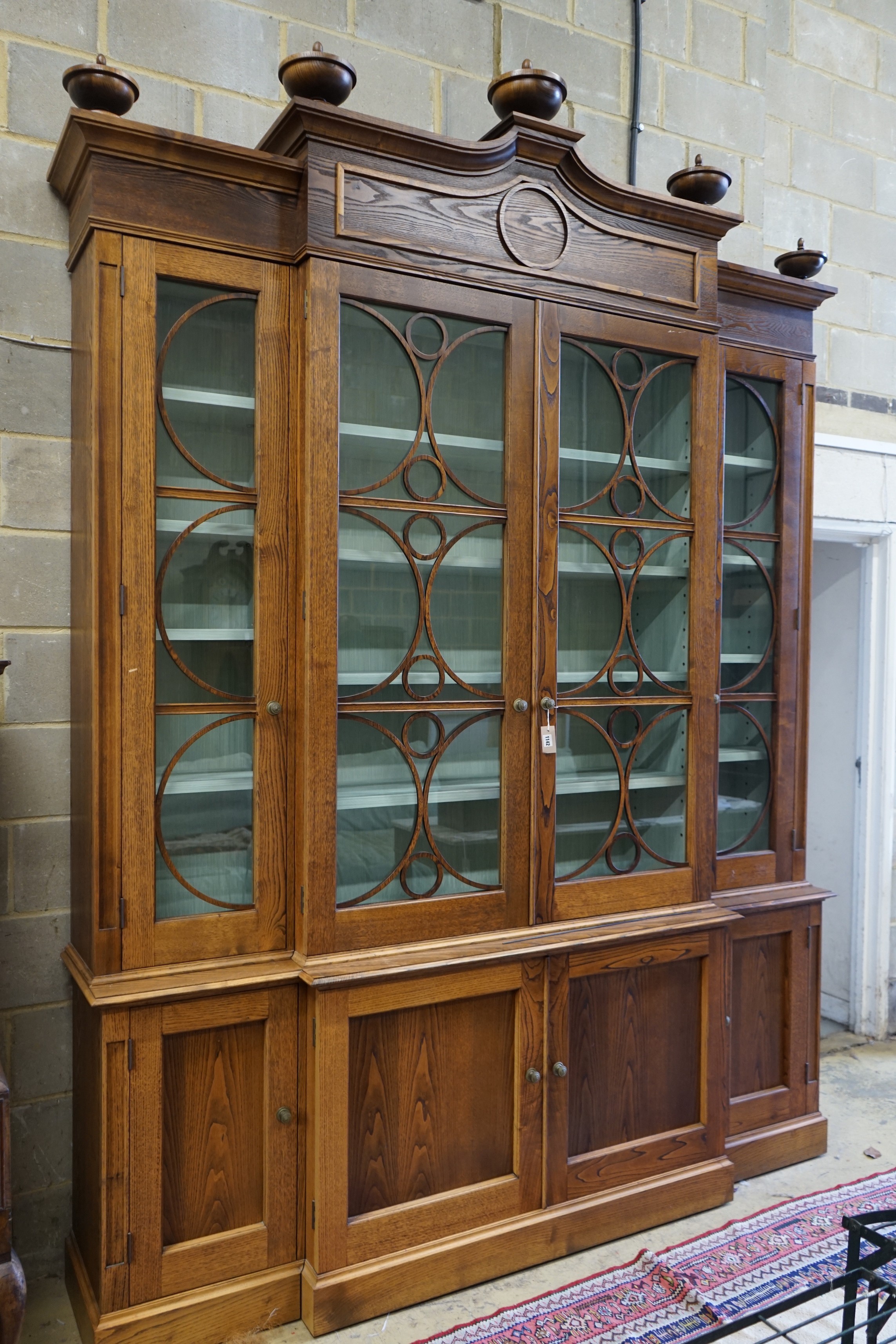 A William Yeoward Cherington chestnut breakfront bookcase, width 220cm, depth 49cm, height 295cm